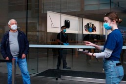 staff-members-assist-customers-prior-entering-bondi-junction-apple-store-limiting-number-visitors-store-one-time-1937281